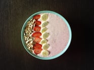 Smoothie bowl with Granny Smith apples, strawberries and yogurt