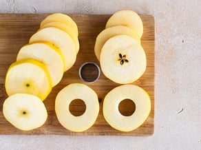 Apple doughnuts on a stick with Golden Delicious apples