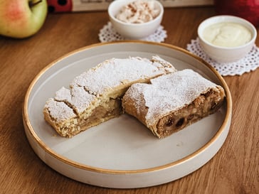 Apple strudel made of short pastry with vanilla espuma